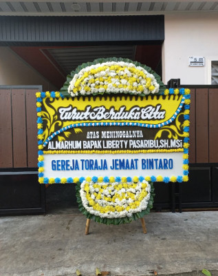 Papan Bunga Duka di Marawola